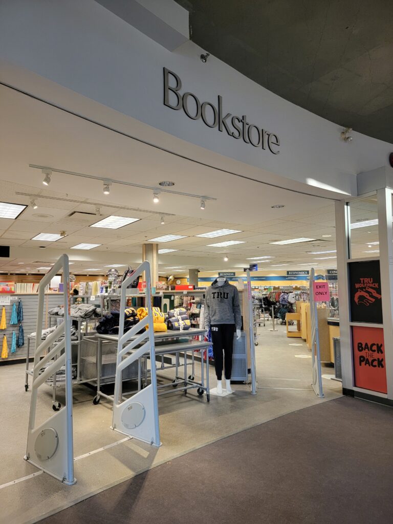 A photo of the front of the TRU bookstore with a display of hoodies at the front.