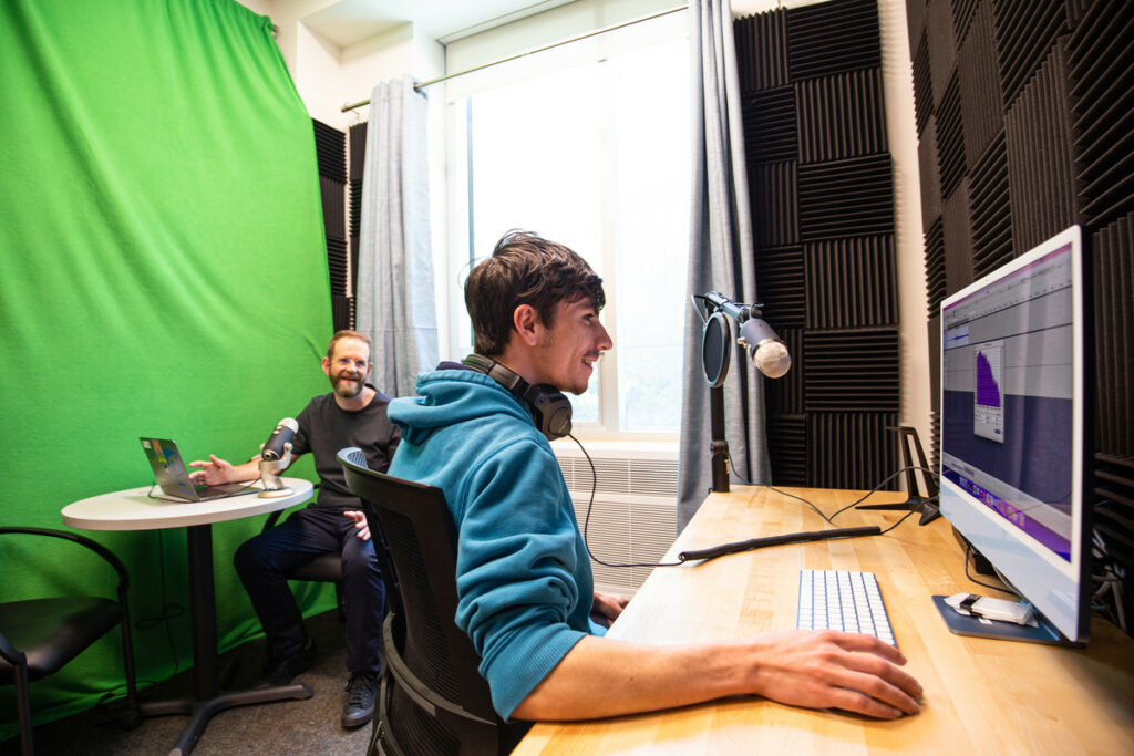 Image of two people working in the Makerspace podcast studio.