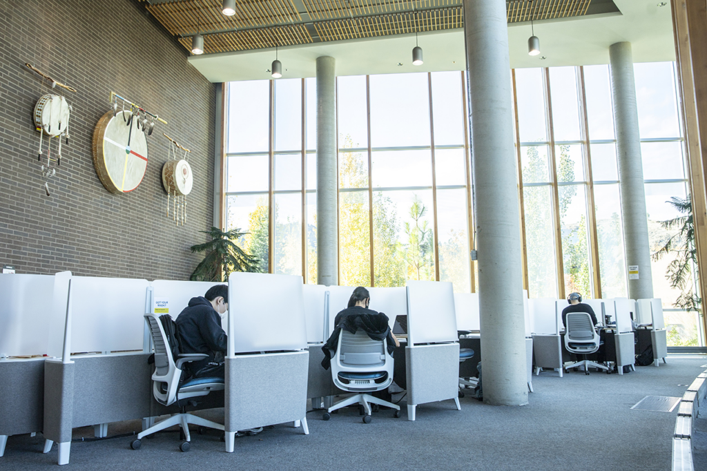 Photo of students using the study pods on the fourth floor of the Brown Family House of Learning.