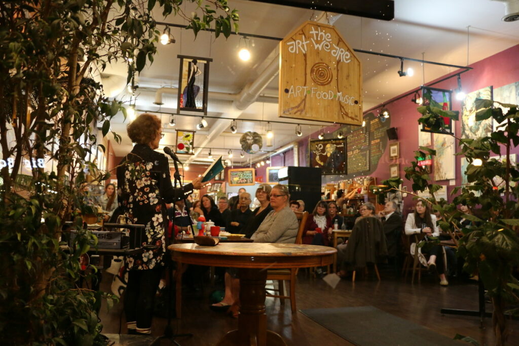 Photo of a book launch event at the Art We Are coffee shop.